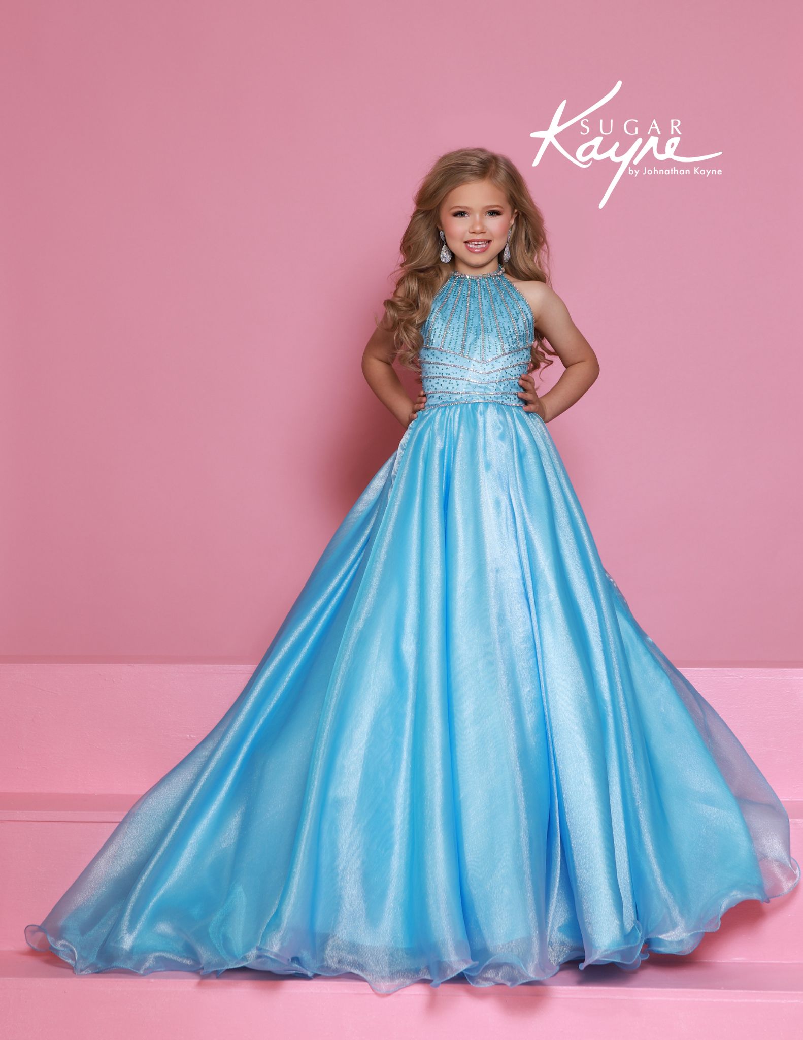 sugar kayne blue girls pageant dress with halter neckline, crystal beadwork, and full shimmering skirt - perfect for glitz pageants and crowning moments.